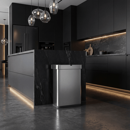 Simplehuman Recycler Can within a Modern kitchen with dark cabinets and marble island.
